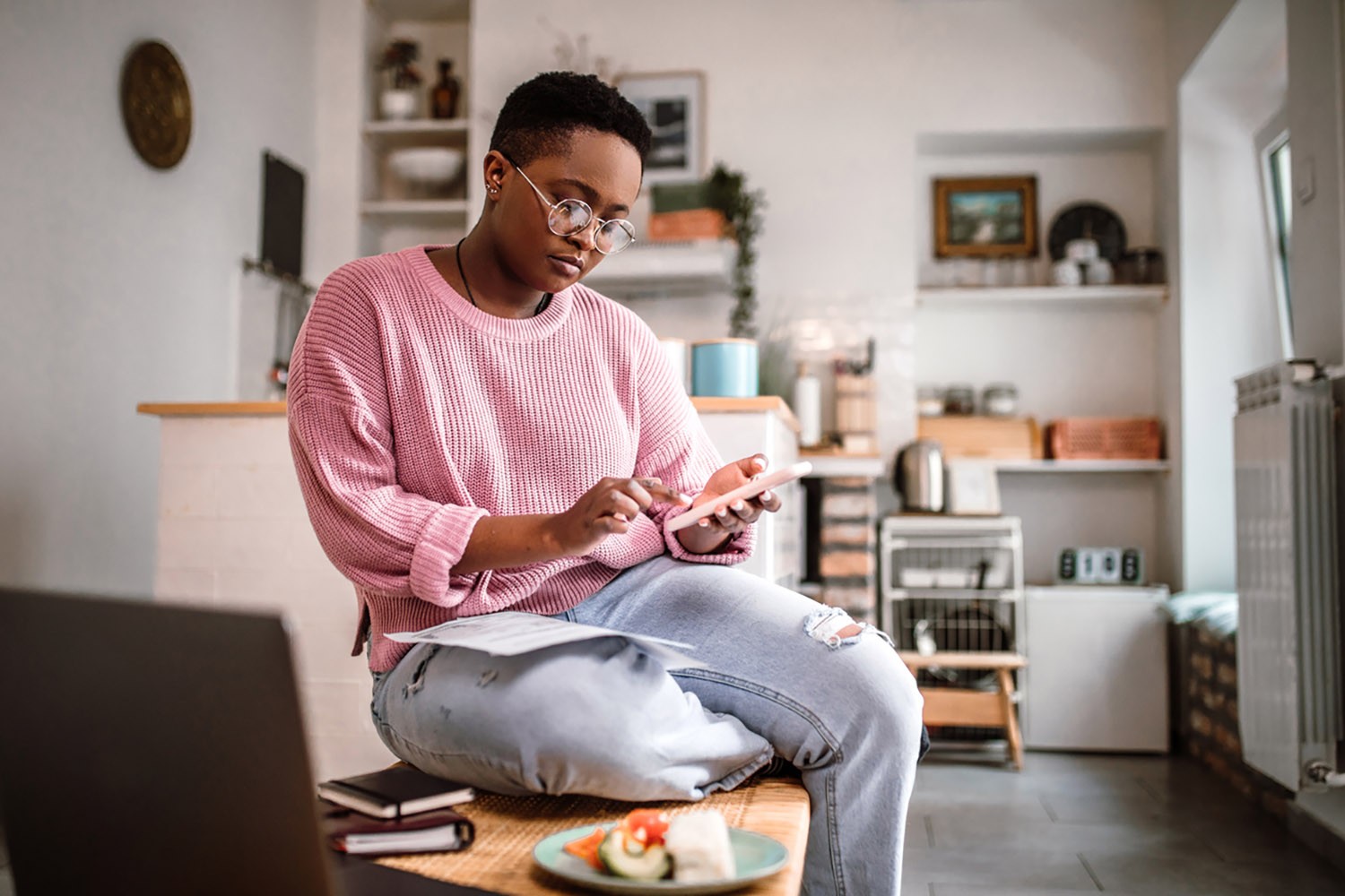 Girl sitting on a chair using her phone