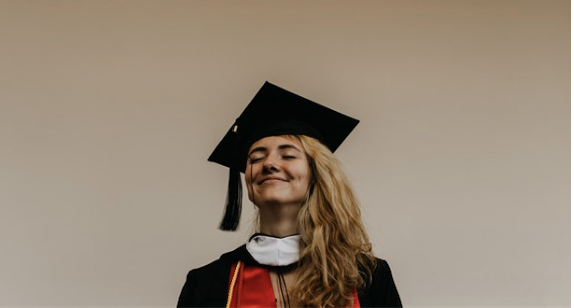 Photo of a young woman in a graduation cap
