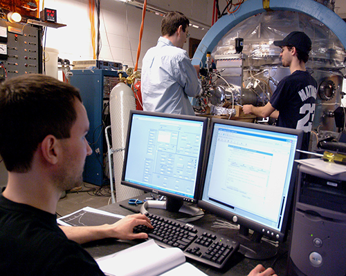 Student researchers working in the lab with their professor 