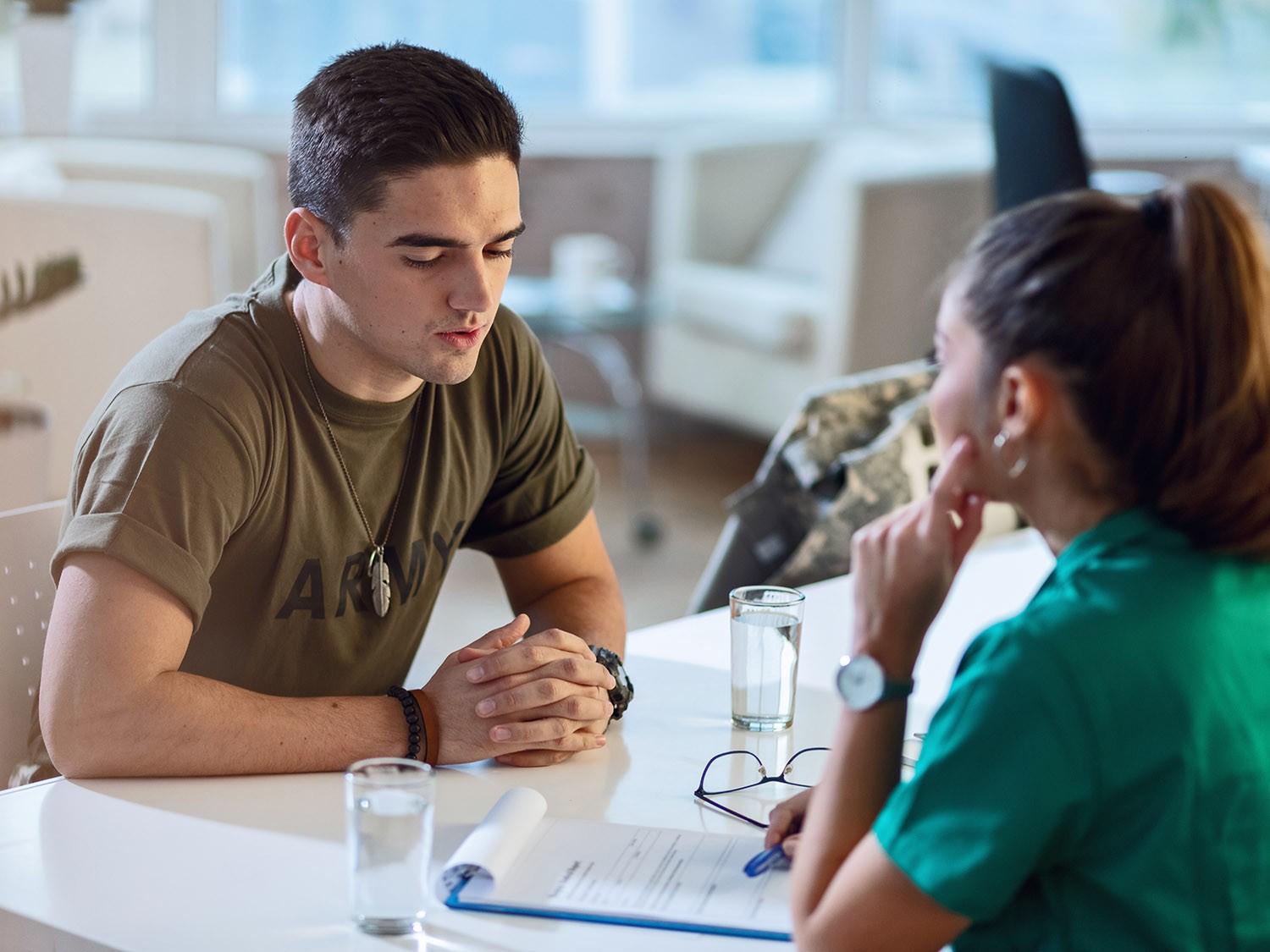 Servicemen talks to medical provider.
